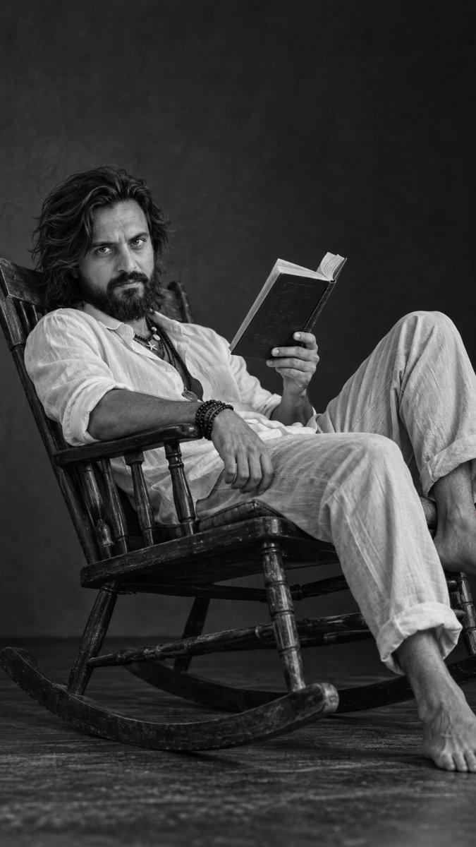 Man sitting and reading book Diinesh Patel AI Prompt Visual